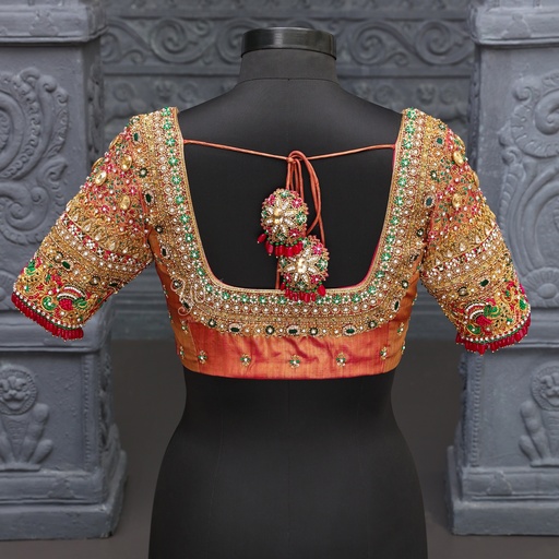 Orange-colored masterpiece of bridal blouse