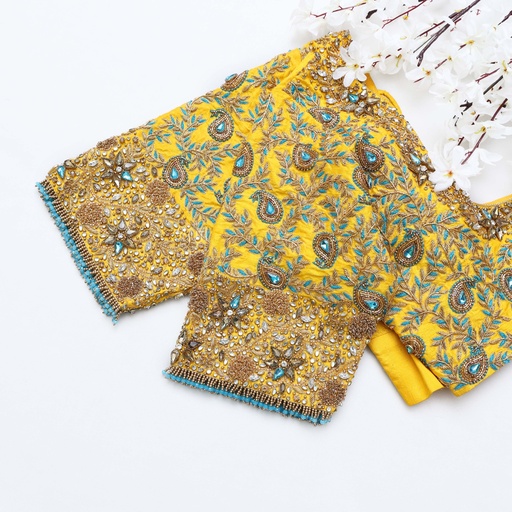 Step up your style game with this captivating yellow embroidery blouse